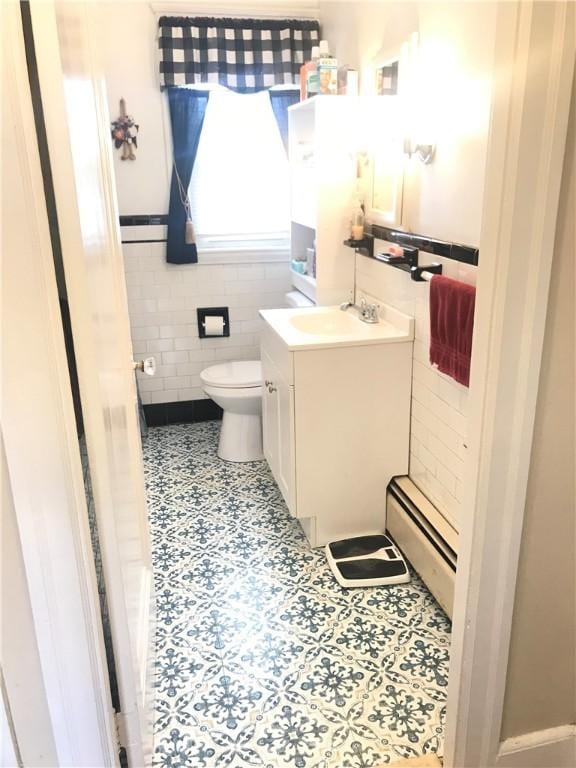 16 Edgemere Rd, Pawtucket, RI 02861 - bathroom with tile walls, vanity, a baseboard heating unit, and tile patterned floors