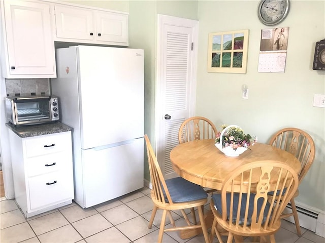 16 Edgemere Rd, Pawtucket, RI 02861 - dining space featuring light tile patterned flooring and a baseboard heating unit