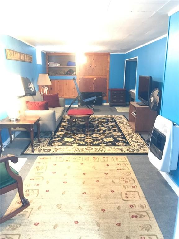 16 Edgemere Rd, Pawtucket, RI 02861 - carpeted living area featuring heating unit