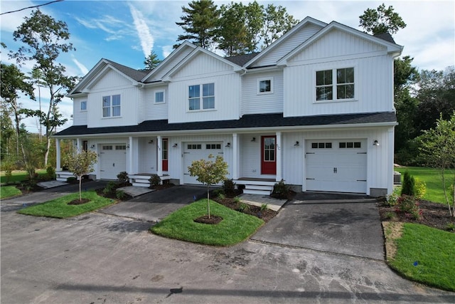 7 Carolina Nooseneck Rd Unit C, Richmond, RI 02898 - modern farmhouse featuring an attached garage, driveway, and a shingled roof