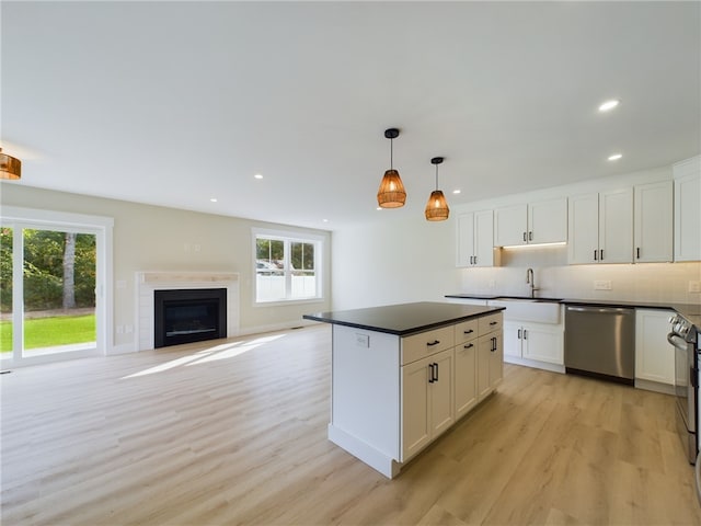 7 Carolina Nooseneck Rd Unit C, Richmond, RI 02898 - kitchen featuring stainless steel dishwasher, dark countertops, plenty of natural light, light wood-style flooring, and recessed lighting