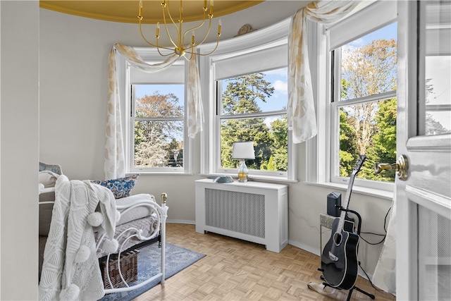 519 Bellevue Ave Unit 2N, Newport, RI 02840 - sitting room with radiator heating unit and a chandelier