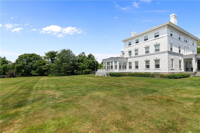 519 Bellevue Ave Unit 2N, Newport, RI 02840 - back of house featuring a chimney and a lawn