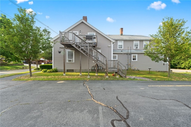18 N Main St, Coventry, RI 02816 - view of front of property featuring stairs, a chimney, and a deck