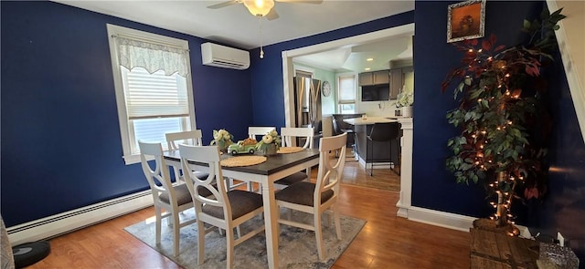 92 Silver Spring Ave, East Providence, RI 02915 - dining area with a baseboard radiator, a wall unit AC, ceiling fan, and plenty of natural light