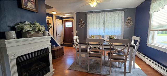 92 Silver Spring Ave, East Providence, RI 02915 - dining room featuring baseboard heating, plenty of natural light, ceiling fan, and wood finished floors