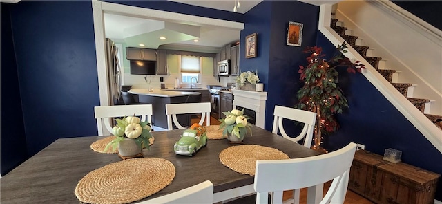 92 Silver Spring Ave, East Providence, RI 02915 - dining area featuring stairway, recessed lighting, and a fireplace