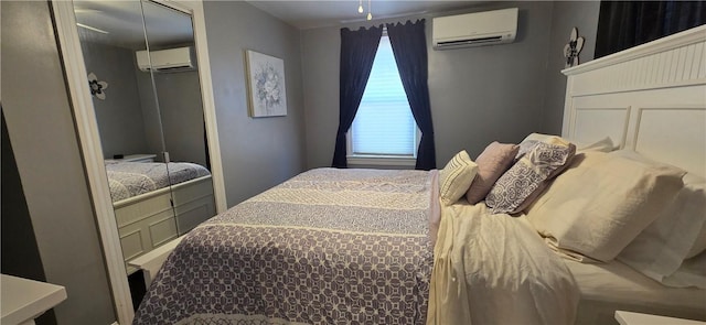 92 Silver Spring Ave, East Providence, RI 02915 - bedroom with a wall mounted air conditioner and a closet
