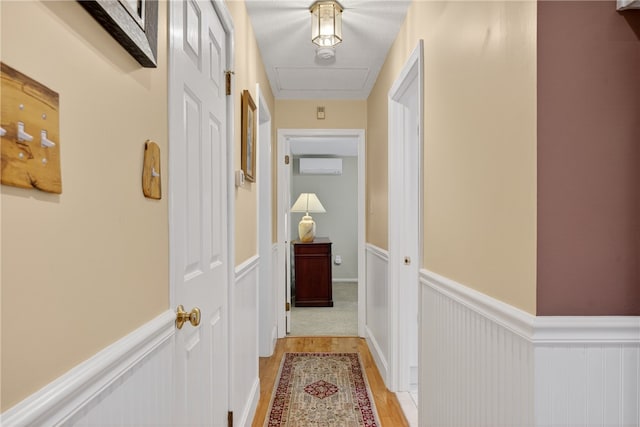 435 Allen Ave, South Kingstown, RI 02879 - hall with wainscoting, light wood finished floors, and a wall mounted AC