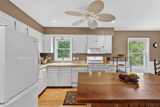 435 Allen Ave, South Kingstown, RI 02879 - kitchen with white appliances, healthy amount of natural light, white cabinetry, light wood finished floors, and recessed lighting