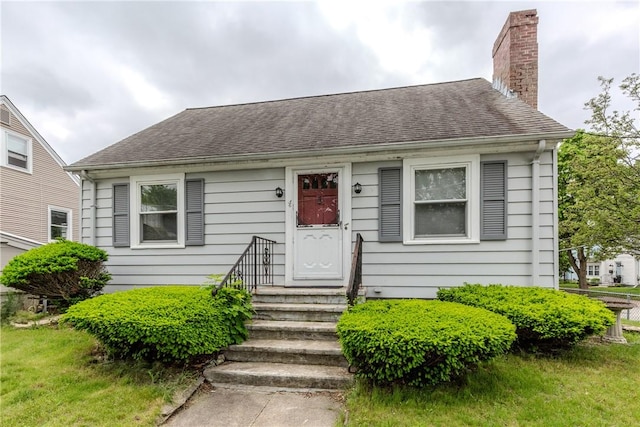 36 Walton St, Providence, RI 02908 - bungalow featuring a chimney and roof with shingles