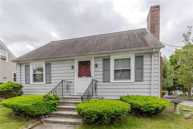 36 Walton St, Providence, RI 02908 - bungalow featuring a chimney and roof with shingles