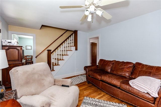 36 Walton St, Providence, RI 02908 - living room featuring light wood-type flooring, stairs, and ceiling fan