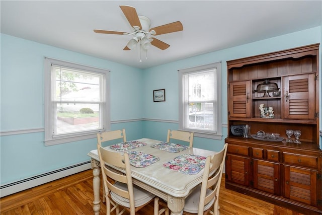 36 Walton St, Providence, RI 02908 - dining room with a baseboard heating unit, ceiling fan, plenty of natural light, and light wood finished floors