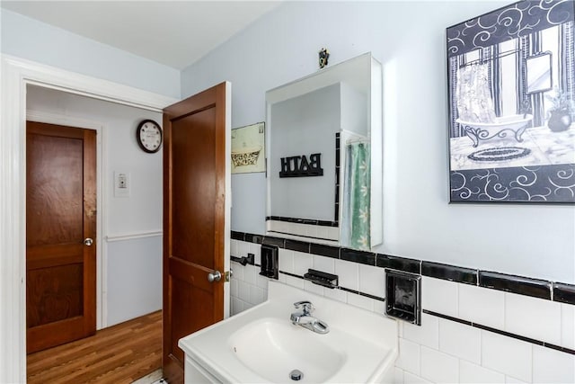 36 Walton St, Providence, RI 02908 - bathroom featuring wood finished floors and tasteful backsplash
