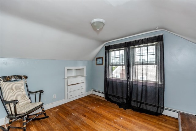 36 Walton St, Providence, RI 02908 - living area featuring hardwood / wood-style floors, lofted ceiling, built in features, and a baseboard radiator