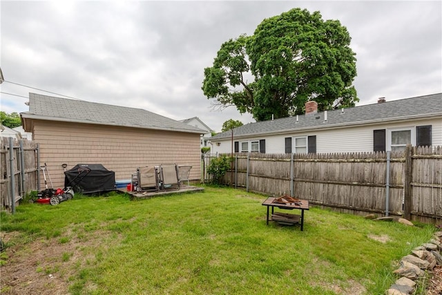 36 Walton St, Providence, RI 02908 - fenced backyard with an outdoor fire pit