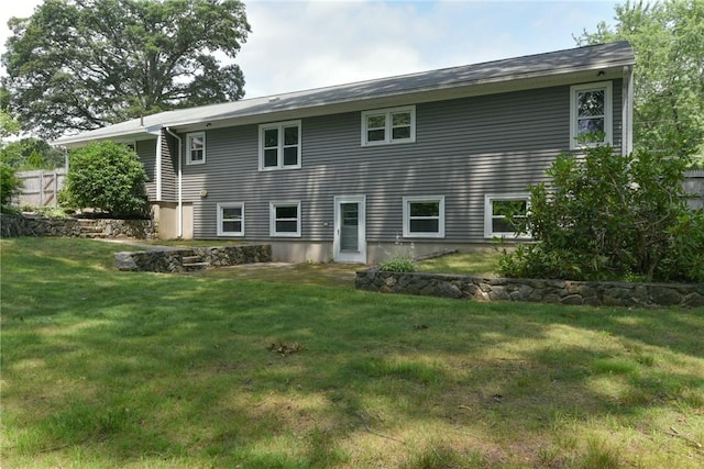44 Cindy Ln, Warwick, RI 02886 - back of house with a yard