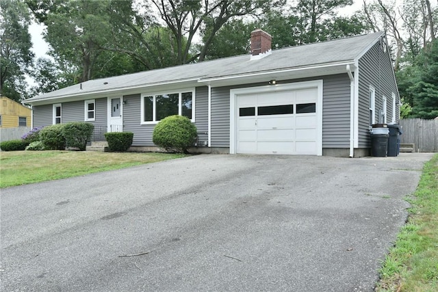 44 Cindy Ln, Warwick, RI 02886 - ranch-style house featuring an attached garage, a chimney, and driveway