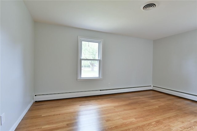 44 Cindy Ln, Warwick, RI 02886 - unfurnished room featuring light wood-type flooring and a baseboard heating unit