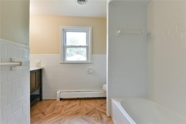 44 Cindy Ln, Warwick, RI 02886 - bathroom with a baseboard heating unit, tile walls, vanity, and wainscoting