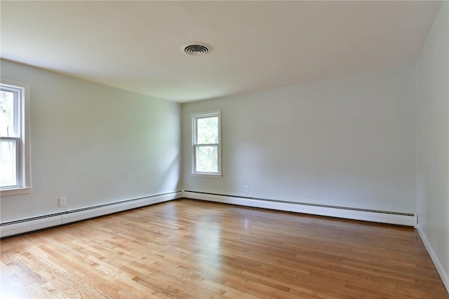 44 Cindy Ln, Warwick, RI 02886 - unfurnished room with wood finished floors and a baseboard heating unit