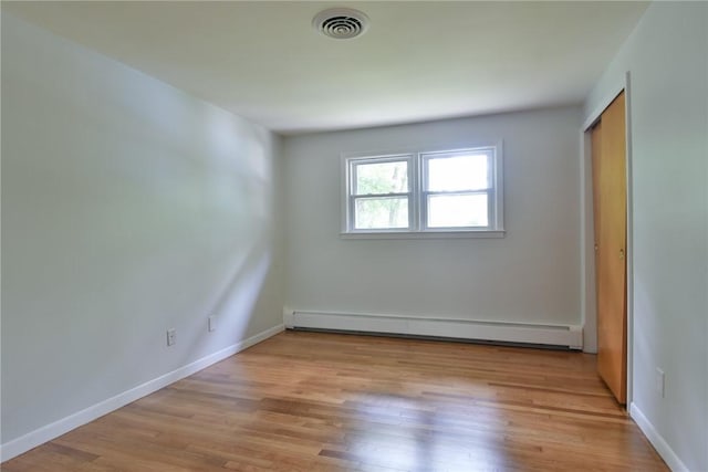 44 Cindy Ln, Warwick, RI 02886 - unfurnished room with a baseboard heating unit and light wood-style floors