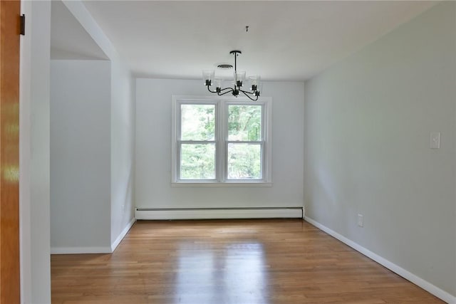 44 Cindy Ln, Warwick, RI 02886 - empty room featuring baseboard heating, a chandelier, and wood finished floors