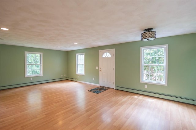 196 William Henry Rd, Scituate, RI 02857 - entryway featuring a baseboard radiator, light wood-type flooring, and recessed lighting