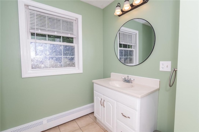 196 William Henry Rd, Scituate, RI 02857 - bathroom featuring baseboard heating, vanity, and tile patterned floors