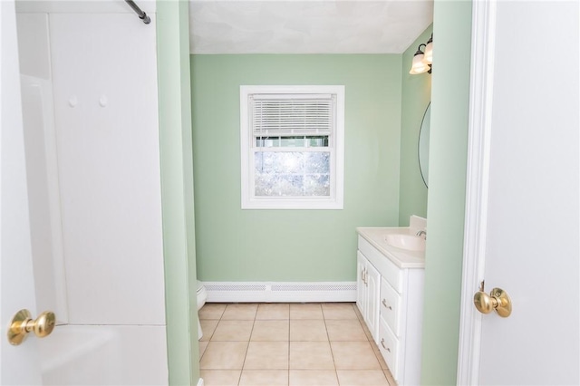 196 William Henry Rd, Scituate, RI 02857 - bathroom featuring baseboard heating, vanity, and tile patterned floors
