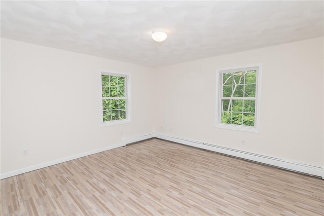196 William Henry Rd, Scituate, RI 02857 - spare room with wood finished floors and a baseboard heating unit