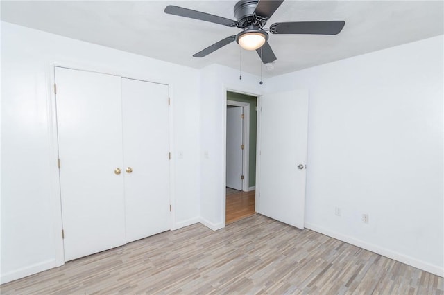 196 William Henry Rd, Scituate, RI 02857 - unfurnished bedroom with light wood finished floors, a closet, and ceiling fan