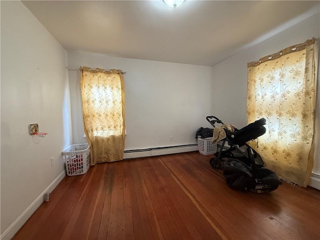 141 Pomona Ave, Providence, RI 02908 - spare room featuring a baseboard radiator and hardwood / wood-style floors