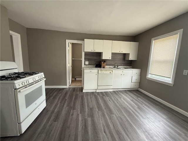 141 Pomona Ave, Providence, RI 02908 - kitchen with white appliances, dark wood-type flooring, light countertops, white cabinets, and tasteful backsplash