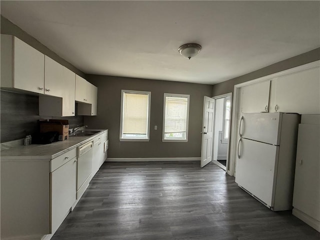 141 Pomona Ave, Providence, RI 02908 - kitchen with white appliances, white cabinets, dark wood finished floors, and light countertops