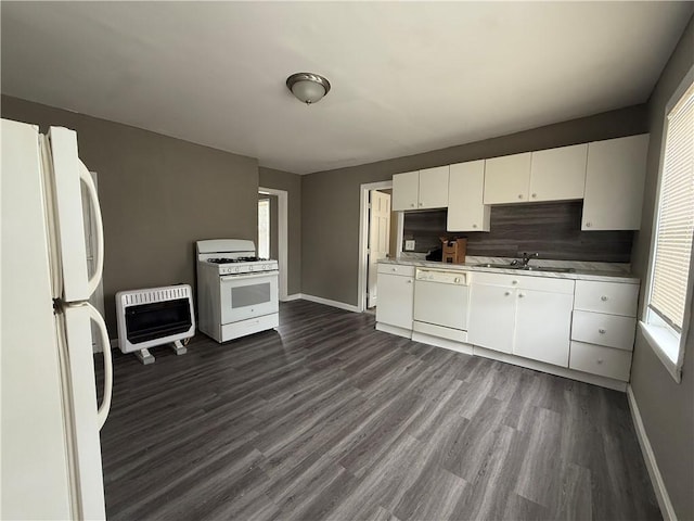 141 Pomona Ave, Providence, RI 02908 - kitchen with white appliances, heating unit, light countertops, dark wood-style flooring, and white cabinetry