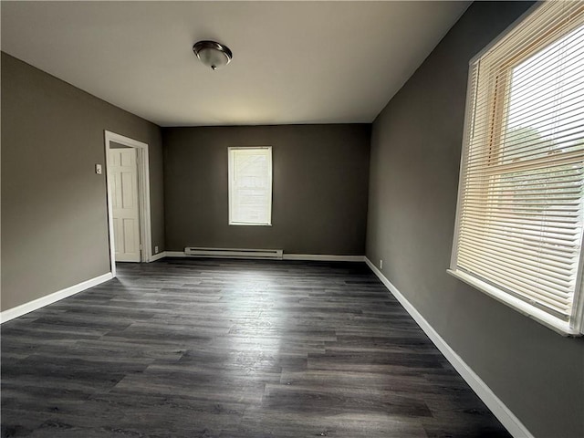 141 Pomona Ave, Providence, RI 02908 - spare room with a baseboard radiator and dark wood-style flooring