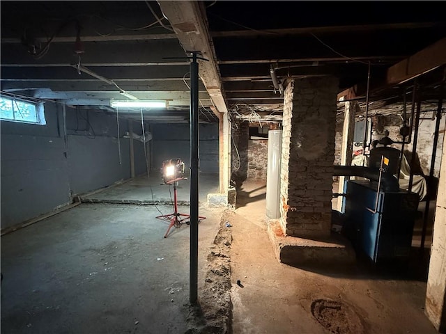 141 Pomona Ave, Providence, RI 02908 - below grade area featuring water heater and a heating unit