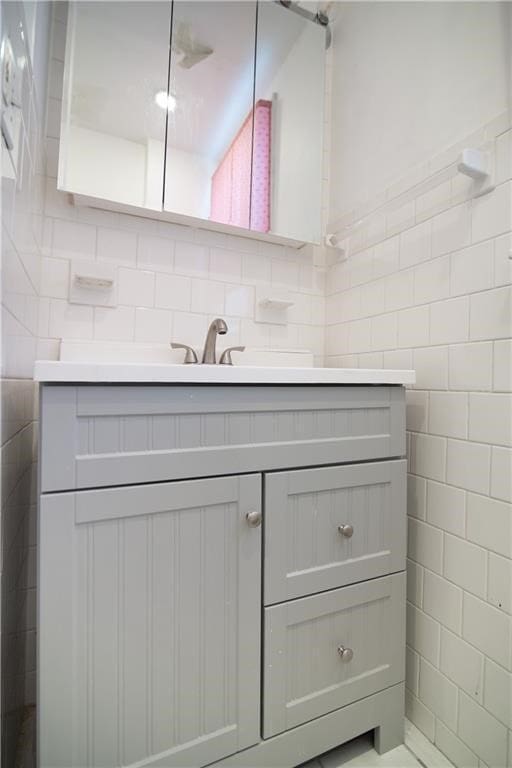 1397 Chalkstone Ave, Providence, RI 02909 - bathroom with vanity and tile walls