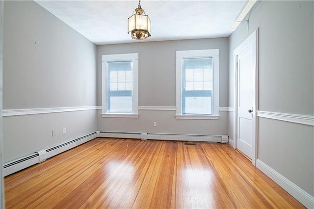 1397 Chalkstone Ave, Providence, RI 02909 - spare room featuring light wood-style flooring, healthy amount of natural light, and baseboard heating