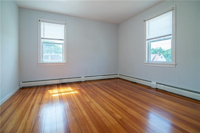 1397 Chalkstone Ave, Providence, RI 02909 - spare room with healthy amount of natural light, hardwood / wood-style floors, and a baseboard radiator