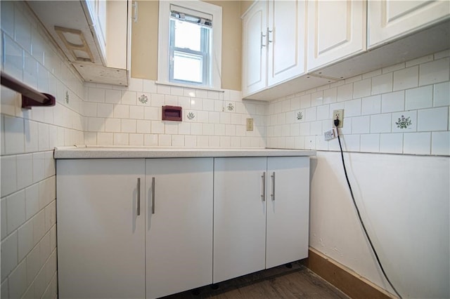 1397 Chalkstone Ave, Providence, RI 02909 - kitchen with white cabinetry, light countertops, dark wood finished floors, and decorative backsplash