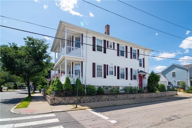 1397 Chalkstone Ave, Providence, RI 02909 - view of front of house with a chimney