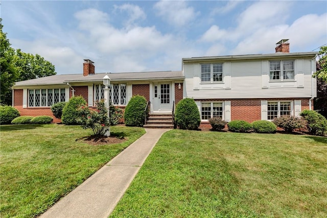 11 Macintosh Dr, Smithfield, RI 02828 - view of front of property with a chimney, brick siding, and a front yard