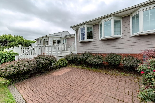 11 Macintosh Dr, Smithfield, RI 02828 - view of side of property featuring a patio area and a deck