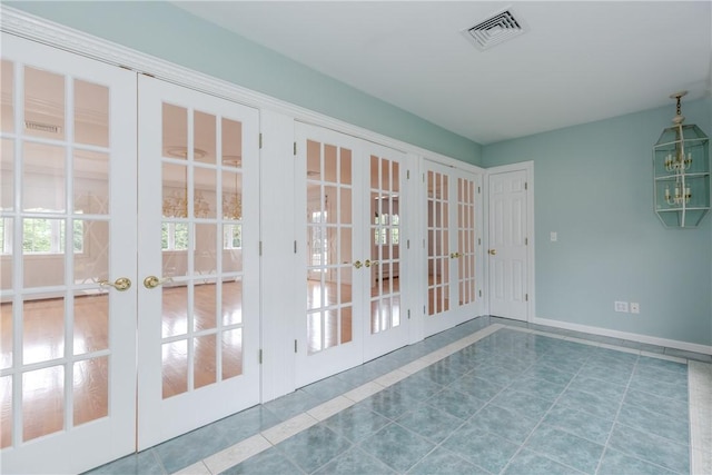 11 Macintosh Dr, Smithfield, RI 02828 - tiled spare room with french doors and baseboards