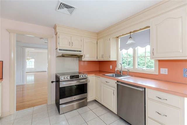 11 Macintosh Dr, Smithfield, RI 02828 - kitchen with appliances with stainless steel finishes, custom range hood, light countertops, and light tile patterned floors