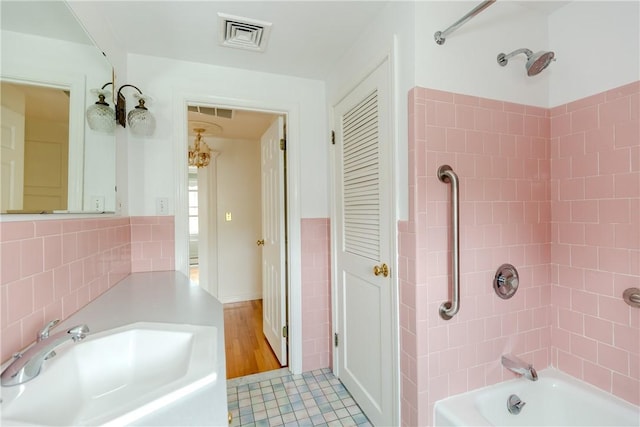 11 Macintosh Dr, Smithfield, RI 02828 - full bath featuring bathtub / shower combination, tile walls, tile patterned flooring, and wainscoting