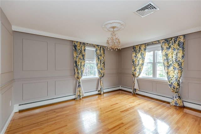 11 Macintosh Dr, Smithfield, RI 02828 - unfurnished room featuring a decorative wall, healthy amount of natural light, a chandelier, ornamental molding, and light wood-style flooring